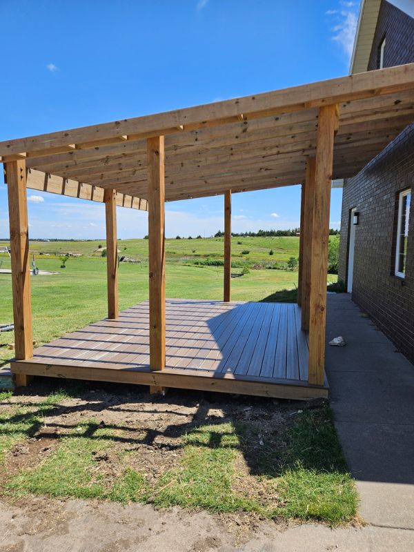 Portrait view of the side of a natural wood outdoor deck.