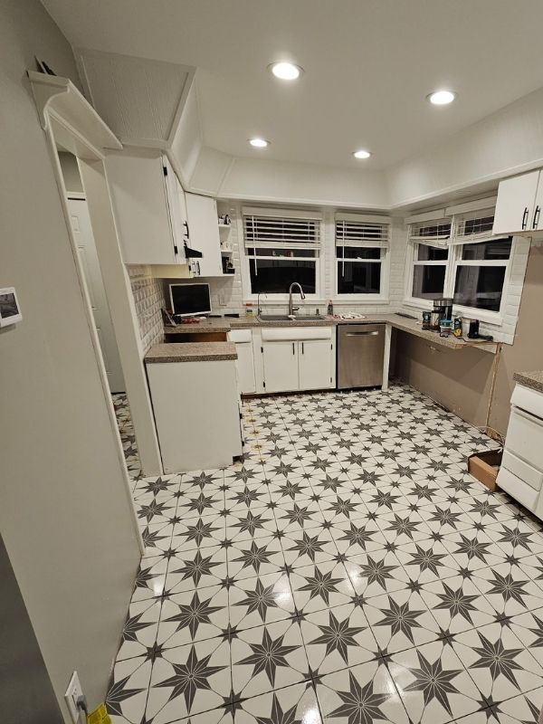Updated kitchen flooring of white and grey patterned tile