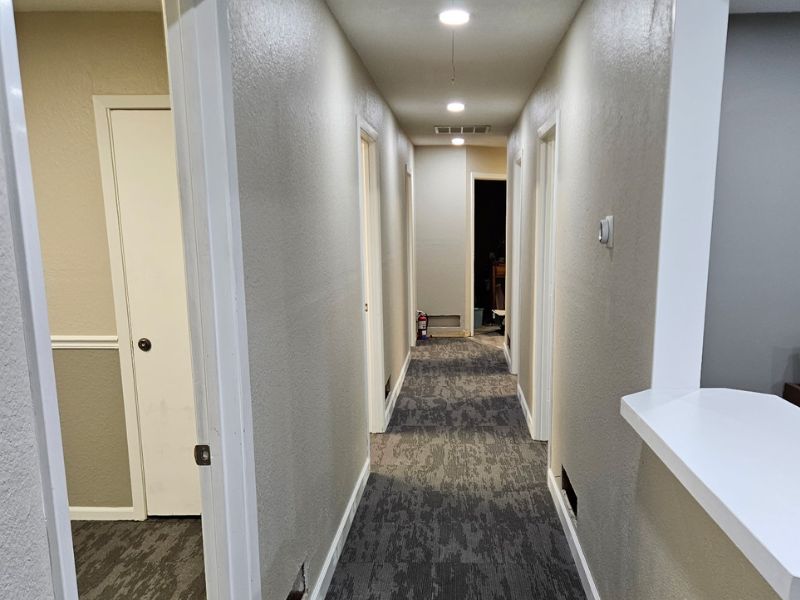 Commercial office space remodeled with fresh paint and update carpet tile flooring.