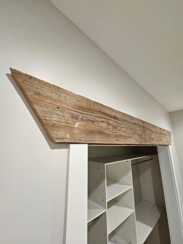 Custom wood accent above a closet in a two bedroom, one bathroom addition in Hays, Kansas.